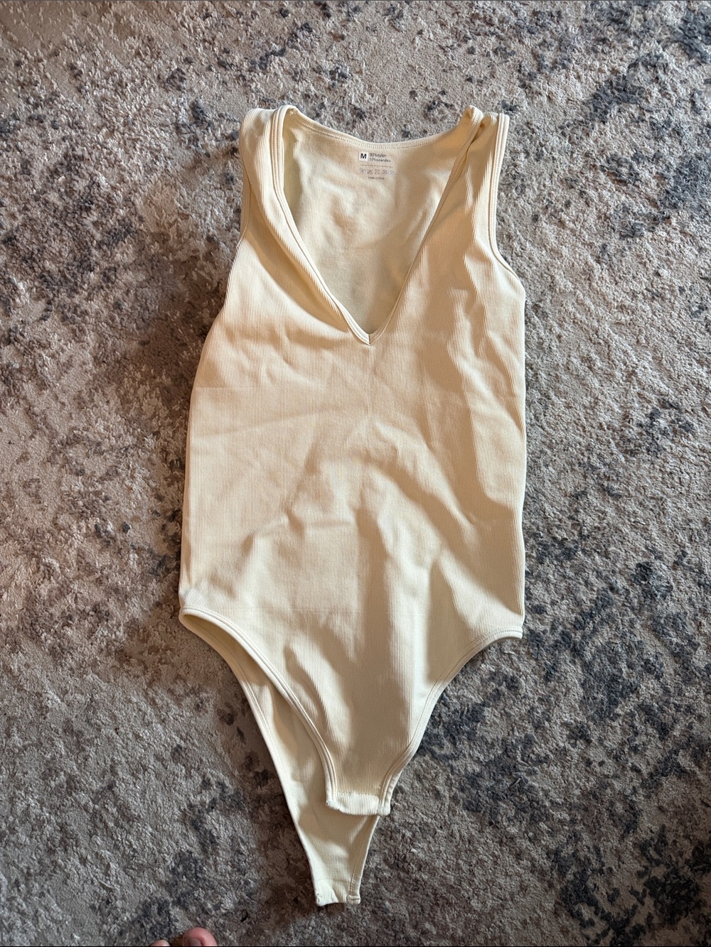 Sleeveless V-Neck Ribbed Bodysuit in Cream